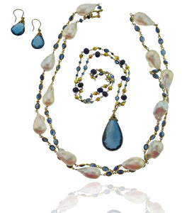 Long blue sapphire and baroque pearl necklace in 18k gold